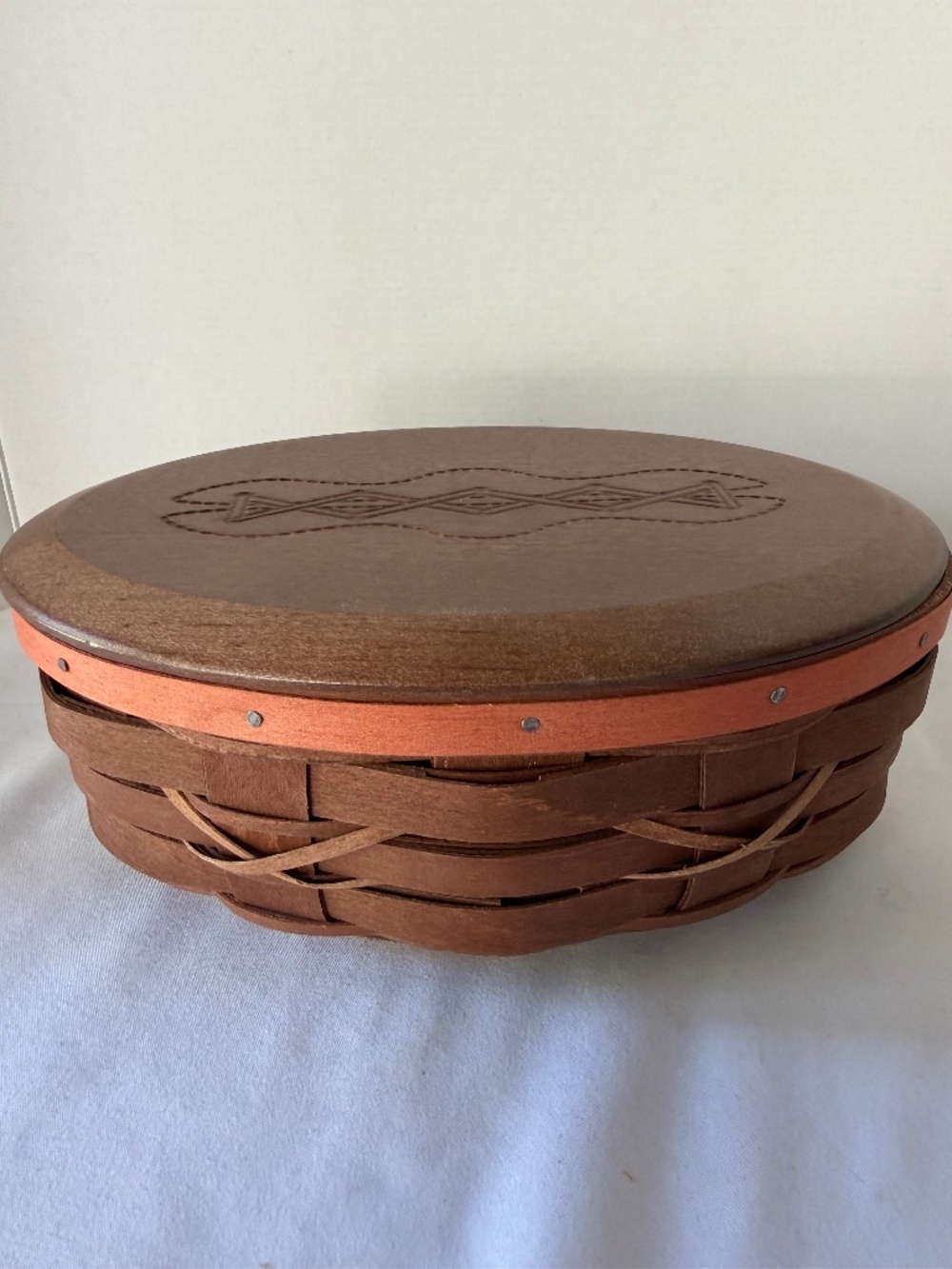 Longaberger Football shaped basket with wooden lid and plastic protector